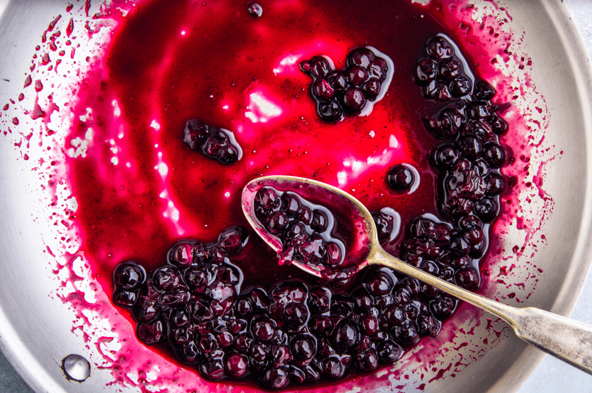 Berries being sauteed into a compote for WeTheTrillions dressing.
